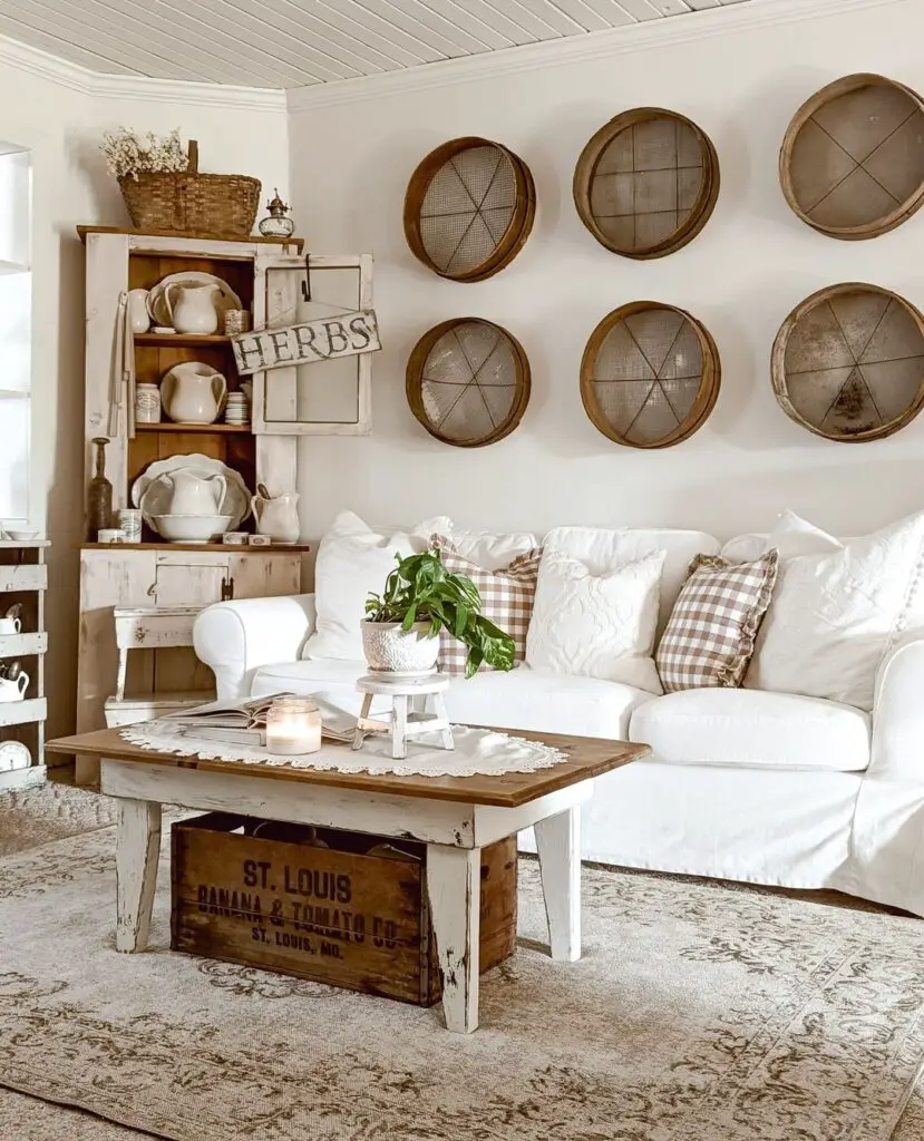 Farmhouse living room with white sofa vintage decor and circular wall hangings