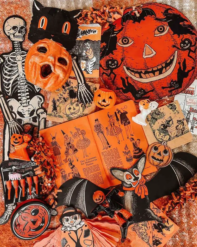 Vintage Halloween decorations and memorabilia in orange and black