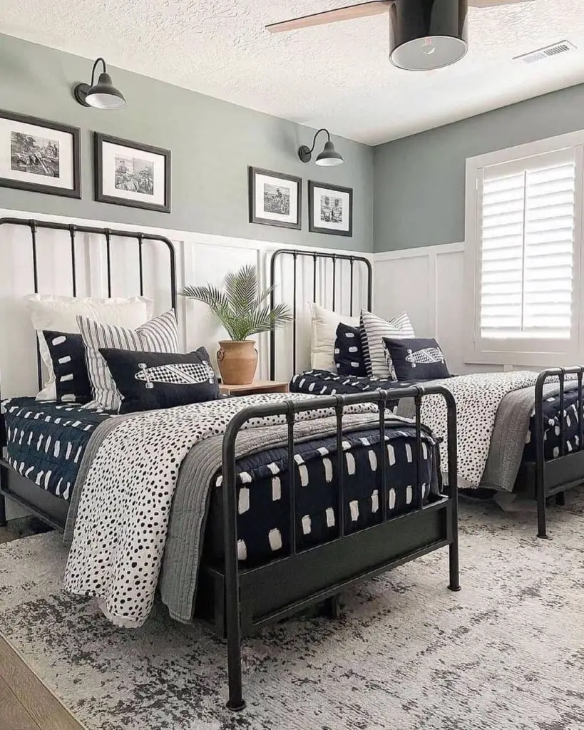 Twin bedroom with black metal beds and patterned bedding