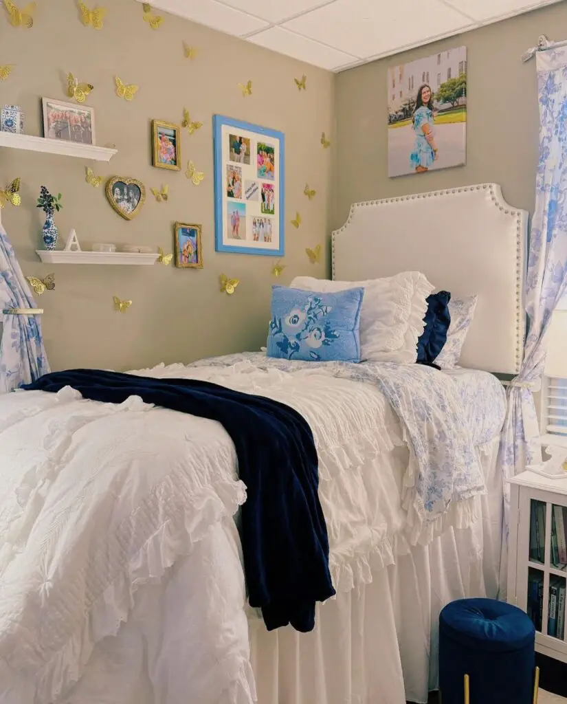 Dorm room with butterfly decor white bedding and photo collages