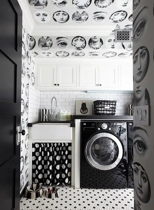 Vibrant floral wallpapered laundry room, green cabinets