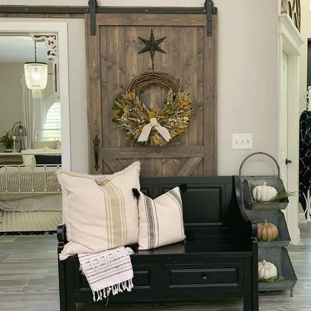 Autumn wreath on rustic sliding barn door