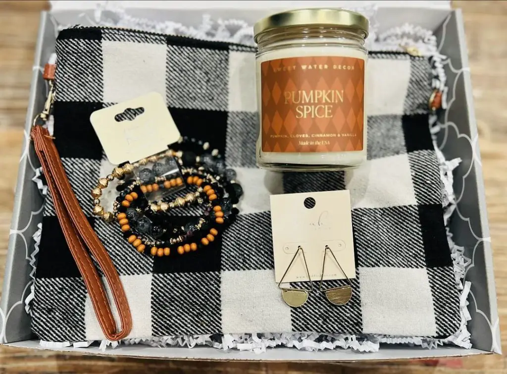 Gift box with buffalo check cloth pumpkin spice candle and jewelry