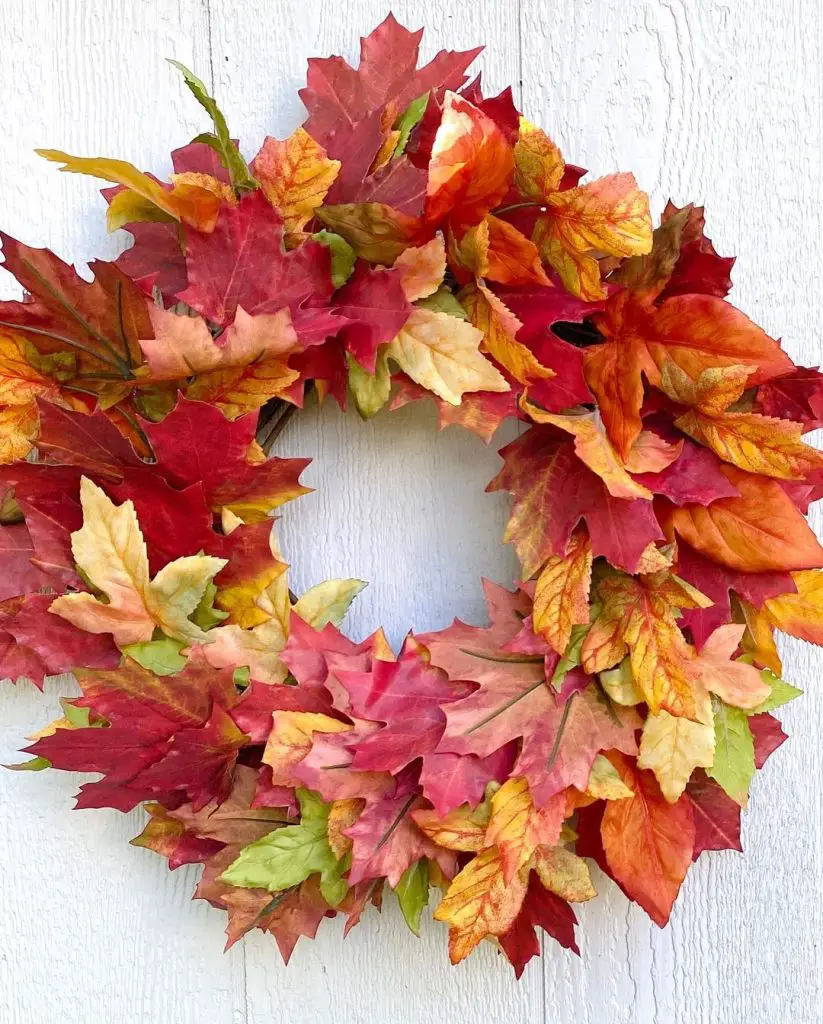 Colorful autumn leaf wreath with red orange and yellow leaves