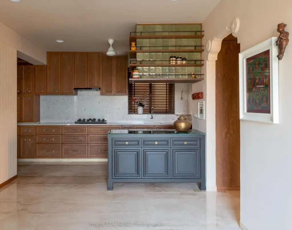 Compact kitchen with wood cabinets, blue island