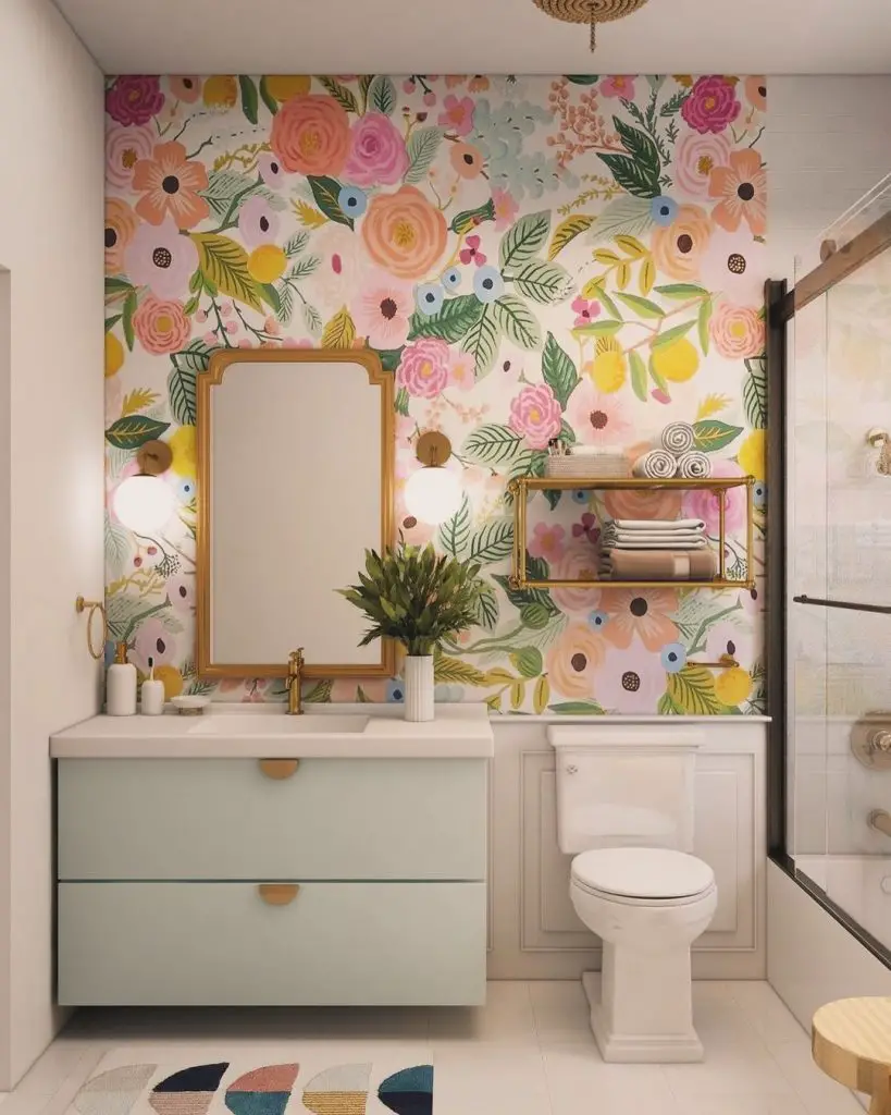 Bathroom with colorful floral wallpaper and mint vanity