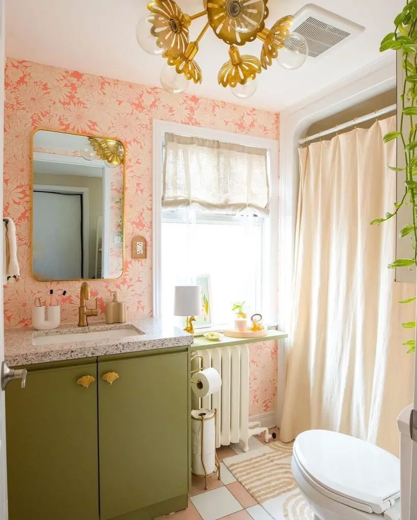 Bathroom with coral floral wallpaper and green vanity