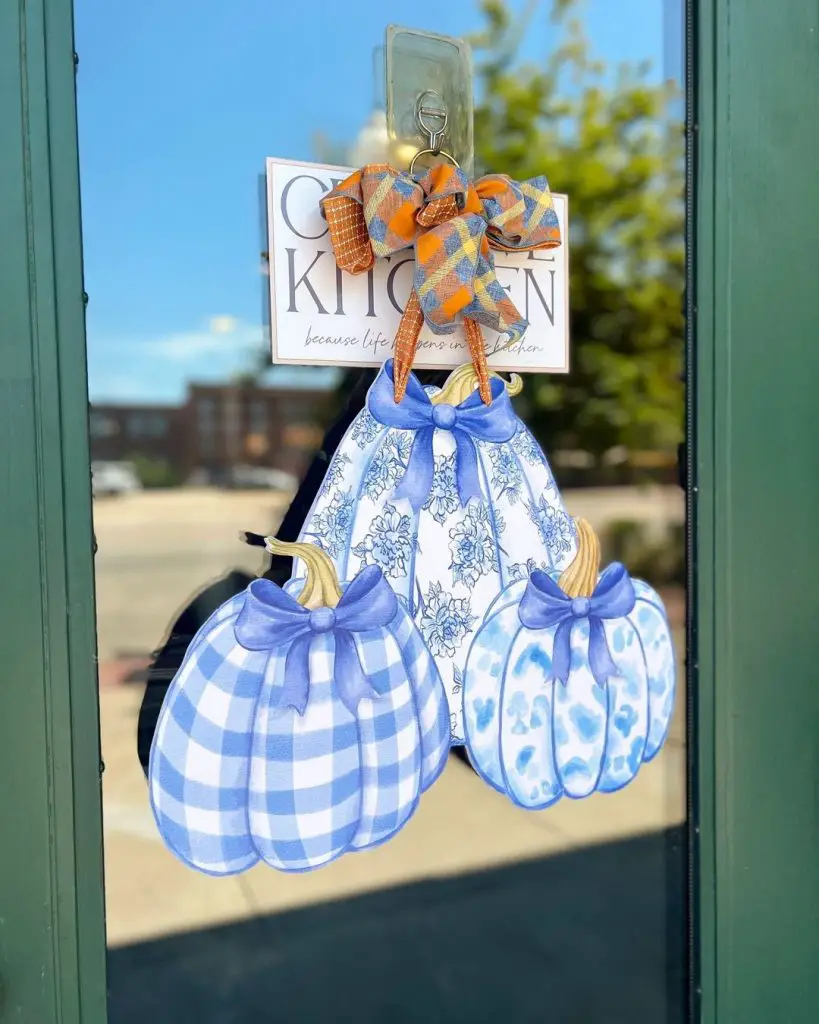 Blue patterned fabric pumpkins hanging on door