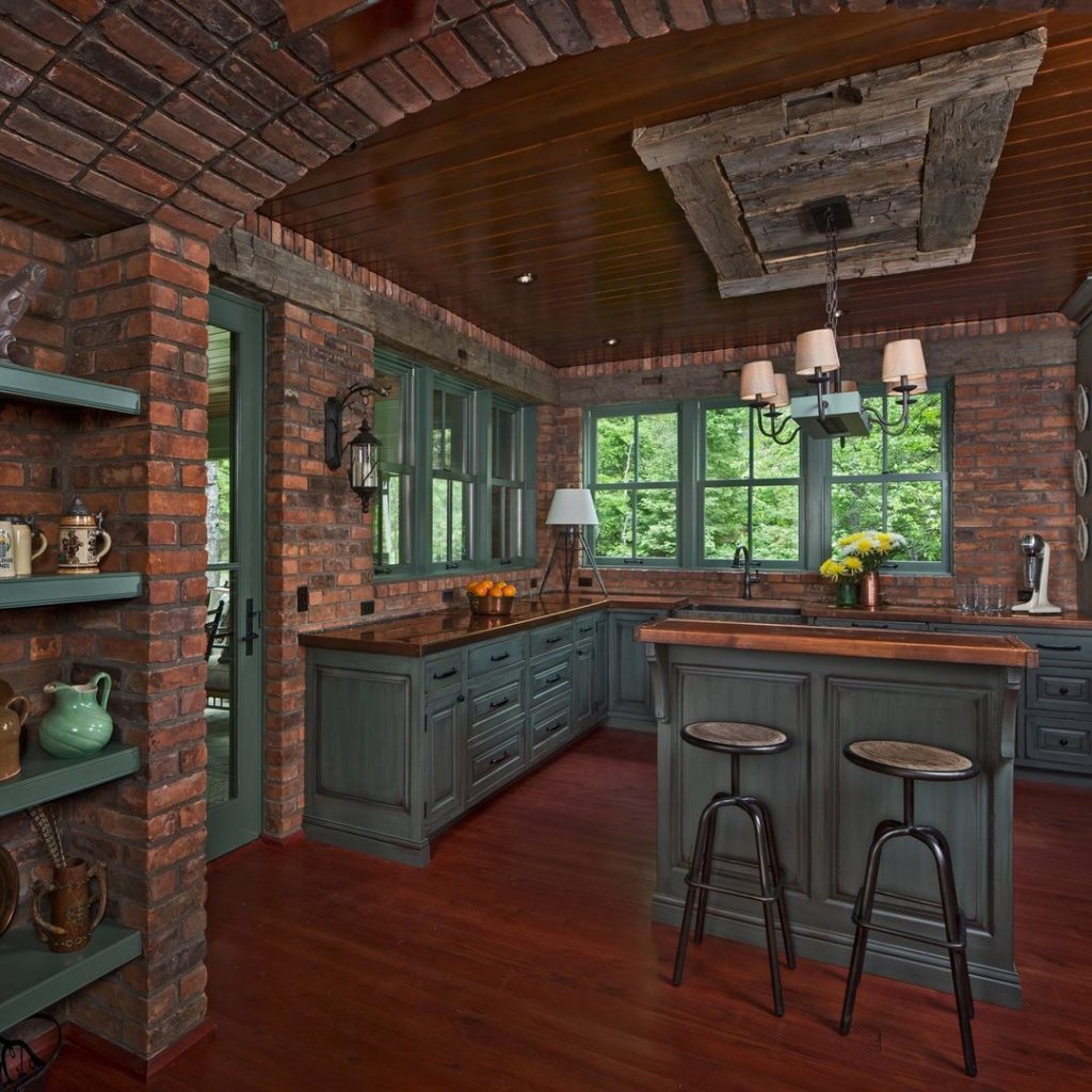 Rustic brick kitchen with forest views