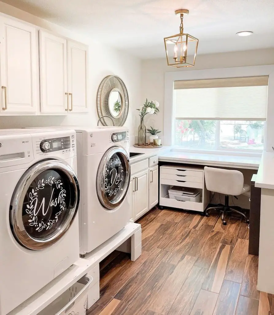 White laundry room with office space and wooden floors