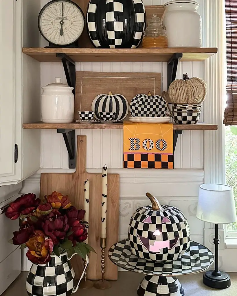 Shelves with black and white checkered pumpkins and Halloween decor