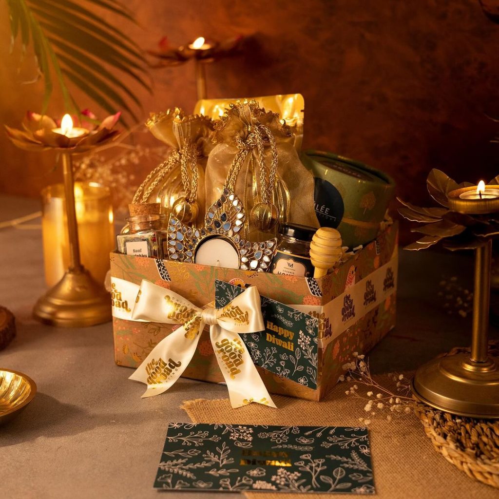 Christmas gift box with candles and festive decorations