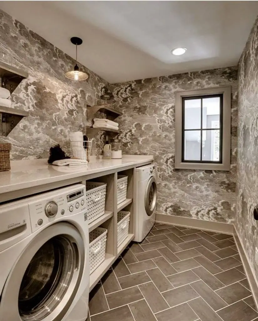 Laundry room with cloud-patterned wallpaper and white appliances.