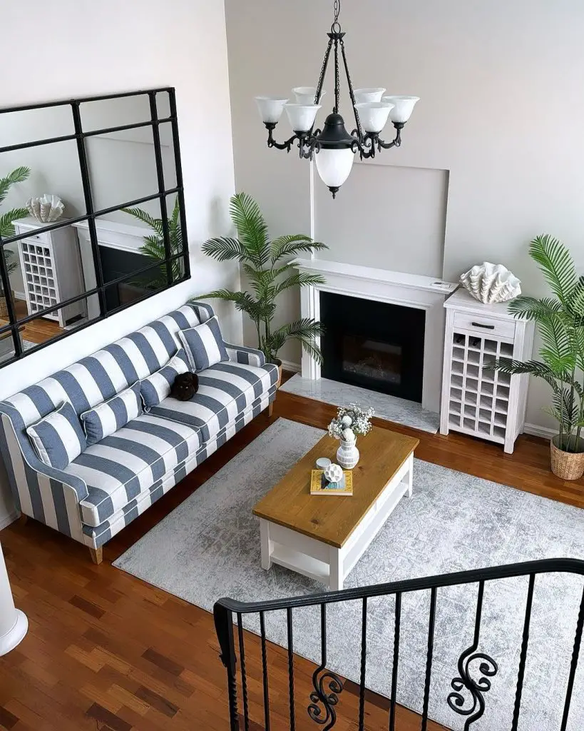 Coastal-inspired living room with striped sofa and tropical accents