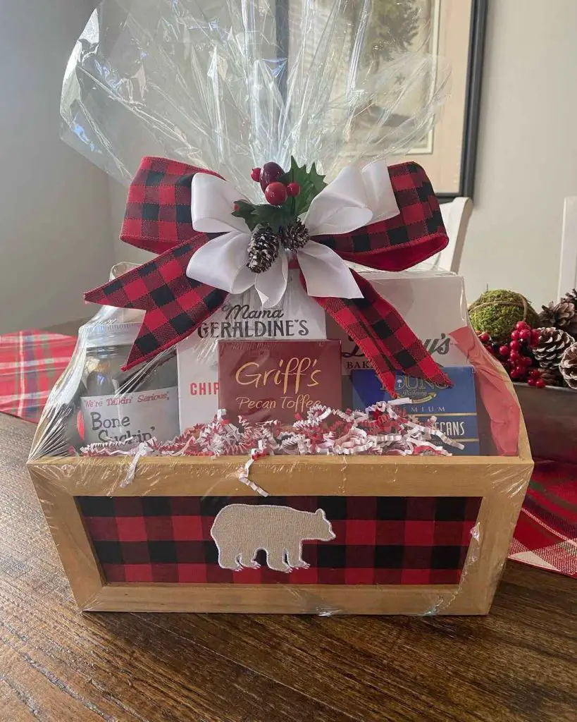 Rustic gift basket with plaid bow and bear motif filled with snacks
