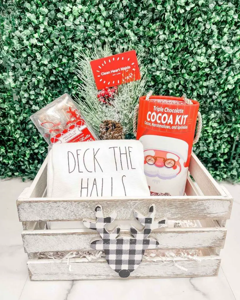 Holiday gift crate with cocoa kit tea towel and festive decorations