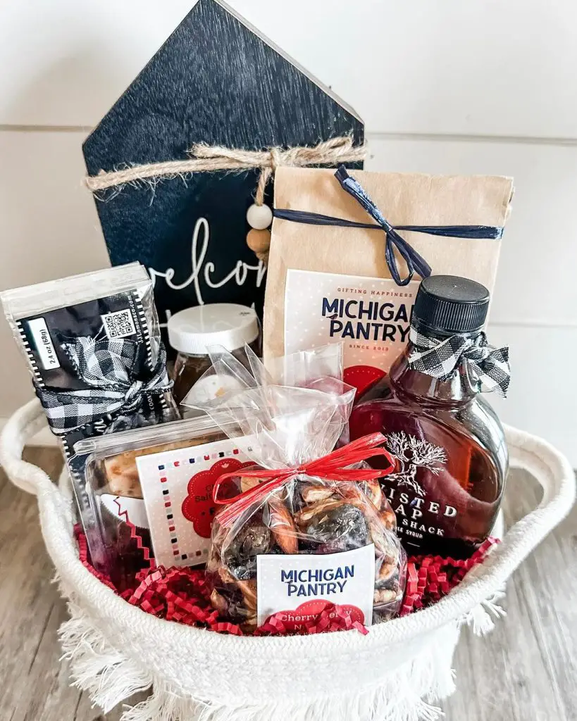 White basket filled with Michigan-themed treats and home decor.