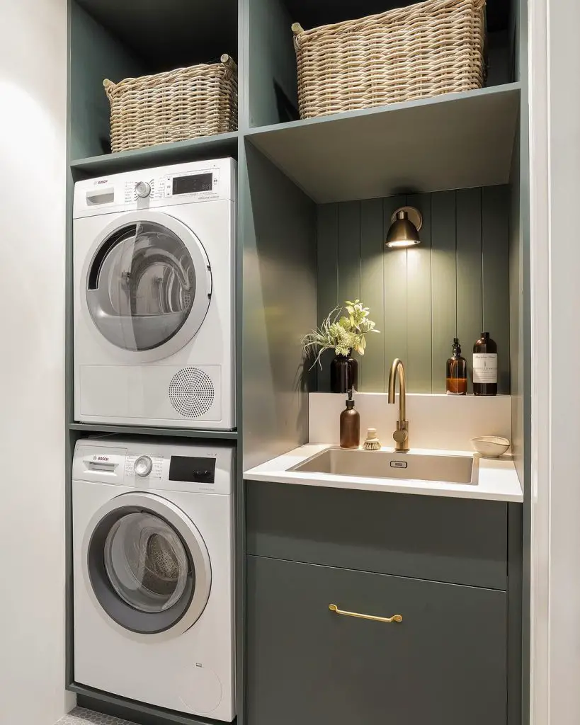 Compact green laundry room with stacked appliances and sink
