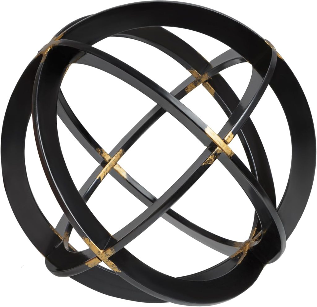 A decorative metal sculpture formed by interlocking black rings with gold accents at the intersections.