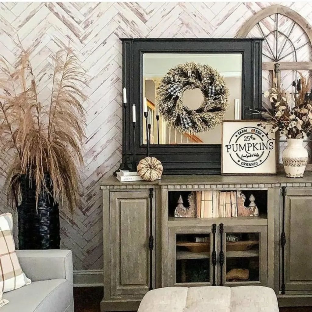 Rustic fall decor on console with mirror wreath