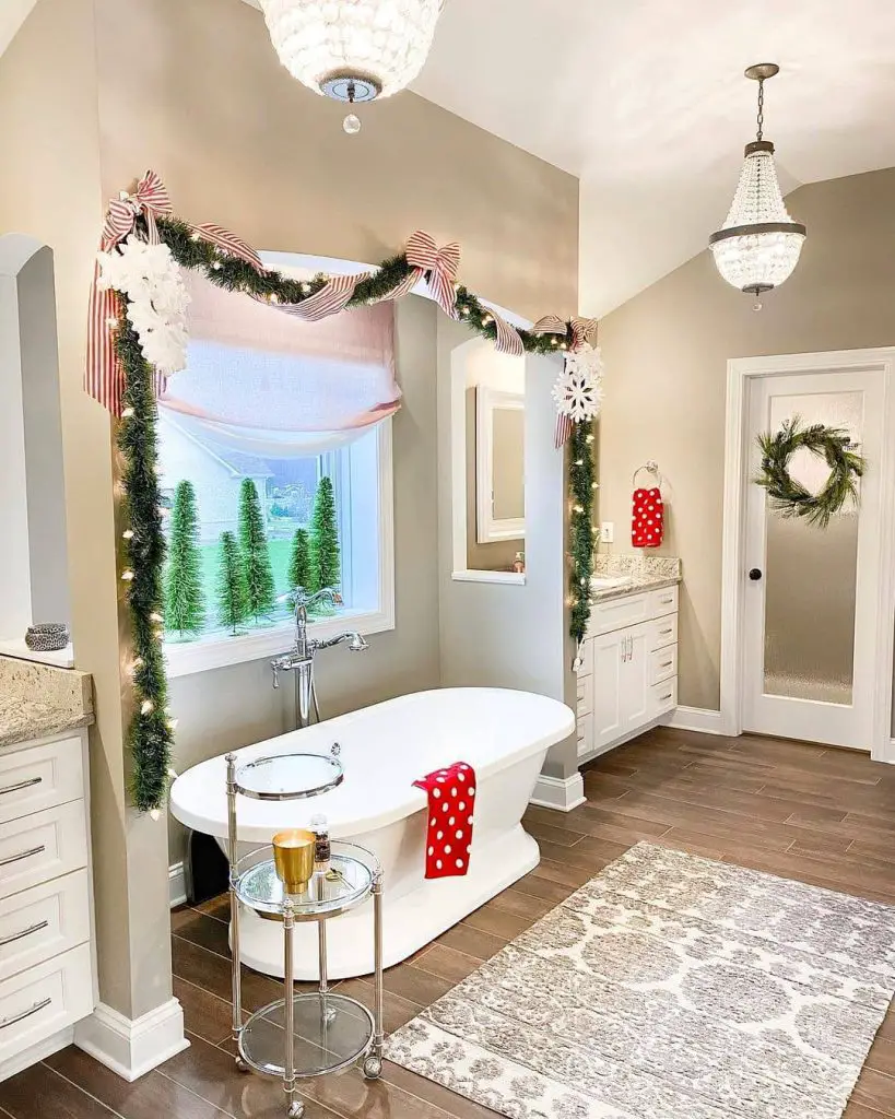 Elegant bathroom with Christmas decorations and freestanding tub.