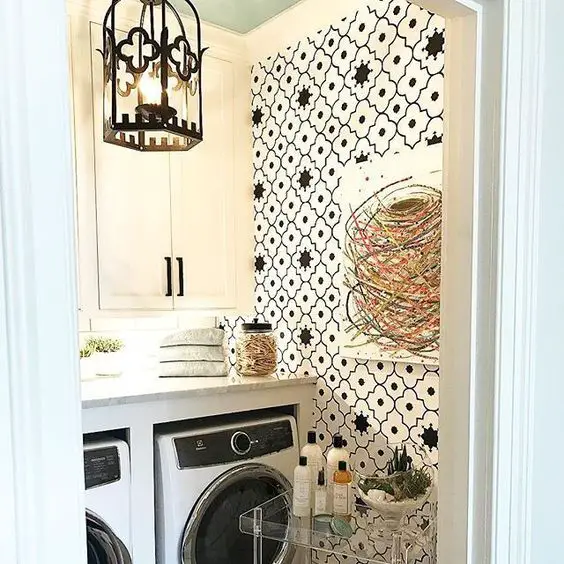Laundry room with floral wallpaper Gothic lantern and modern appliances