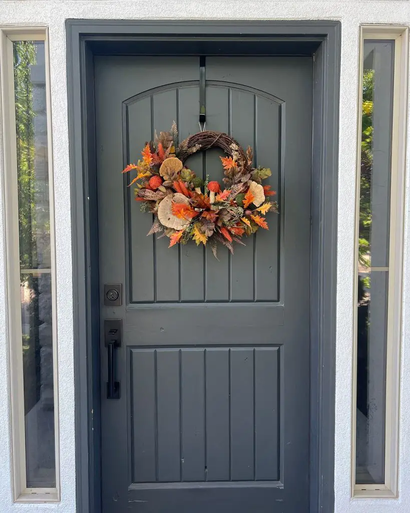 Colorful fall wreath on gray door