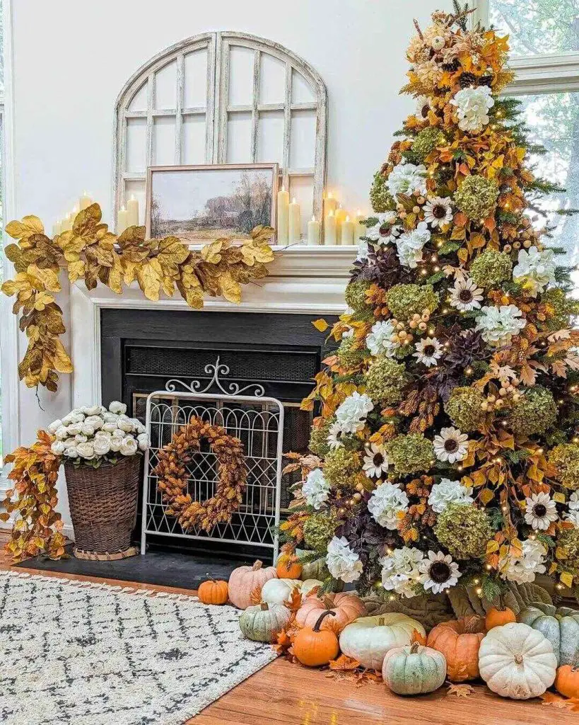 Fireplace decorated with autumn tree pumpkins and fall foliage