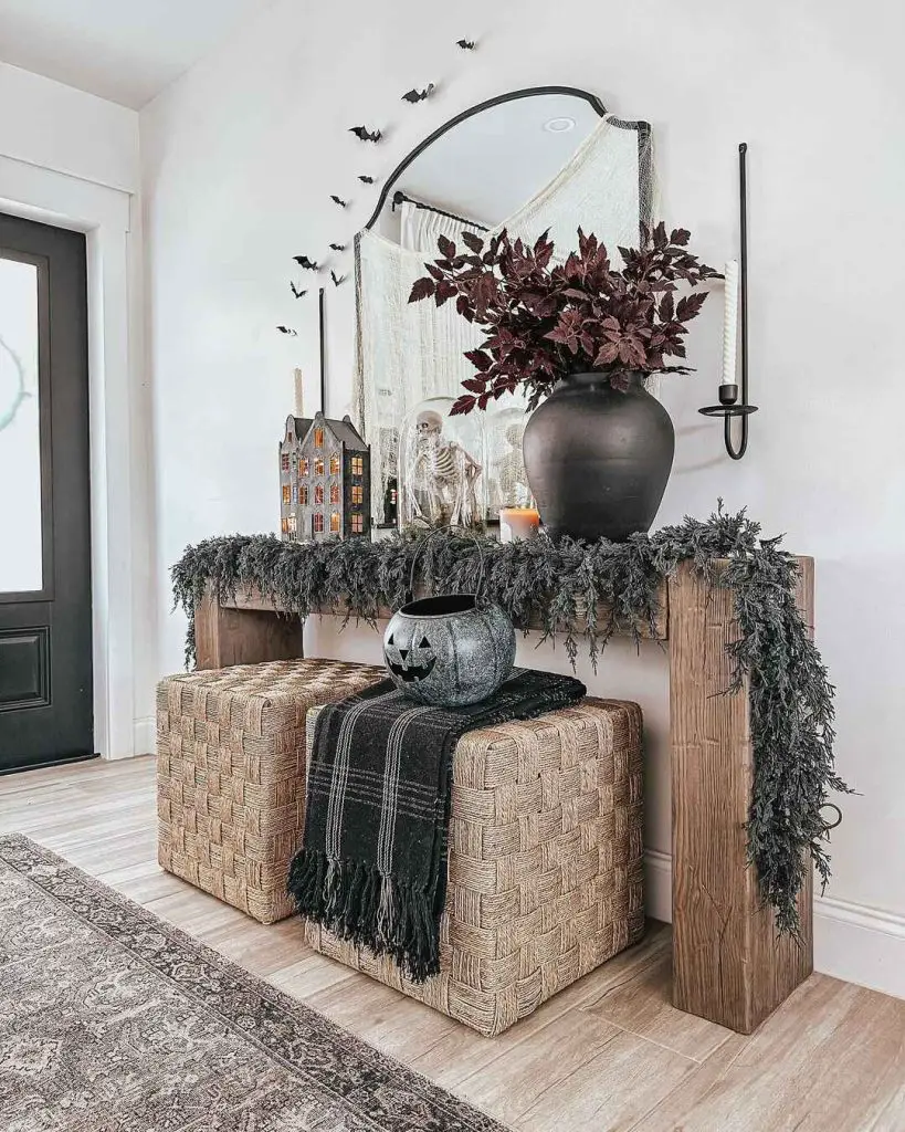 Elegant Halloween entryway with dark decor and subtle spooky elements