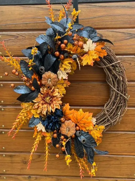 Fall wreath with navy leaves and orange flowers
