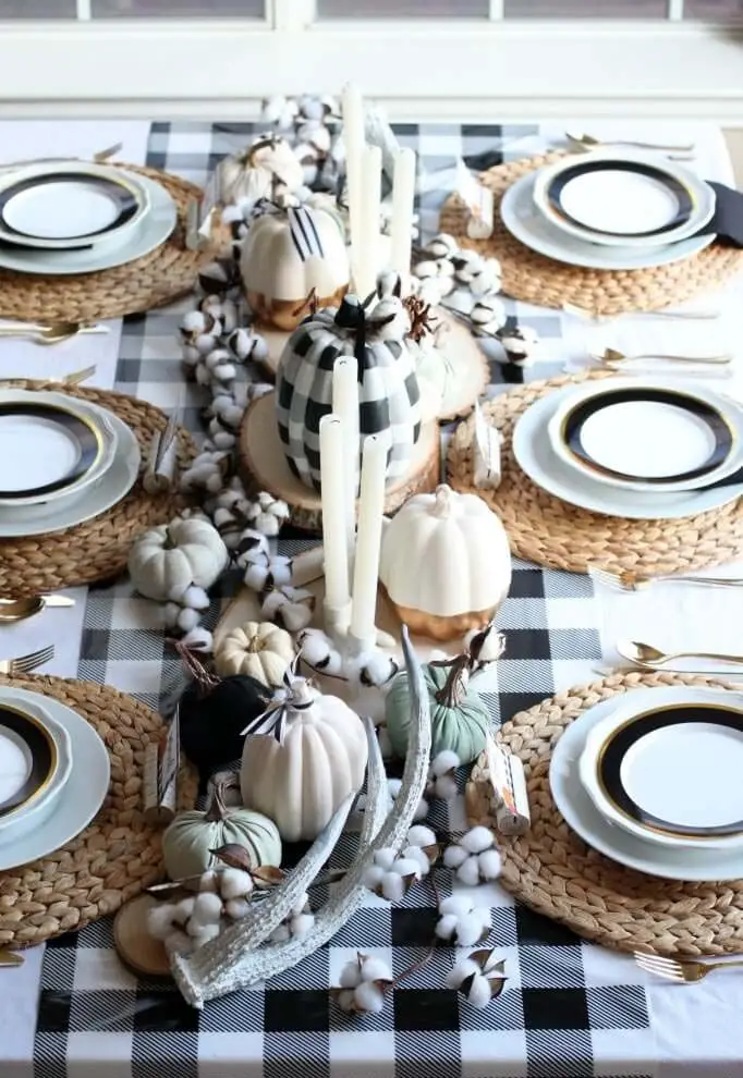 Fall table setting with buffalo check and white pumpkins