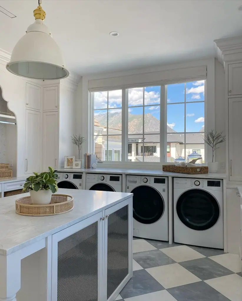Bright laundry room with mountain view window
