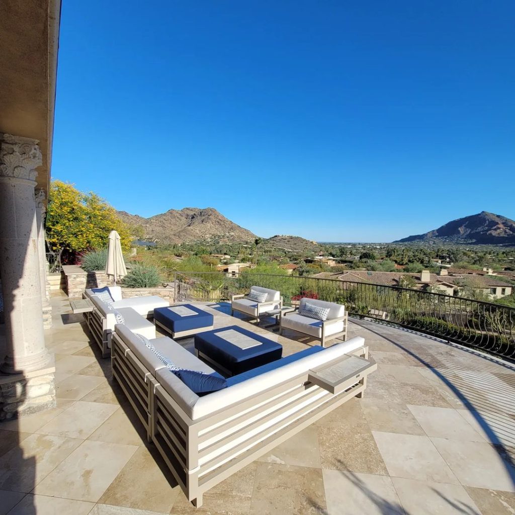 Luxurious patio furniture overlooking desert mountain landscape