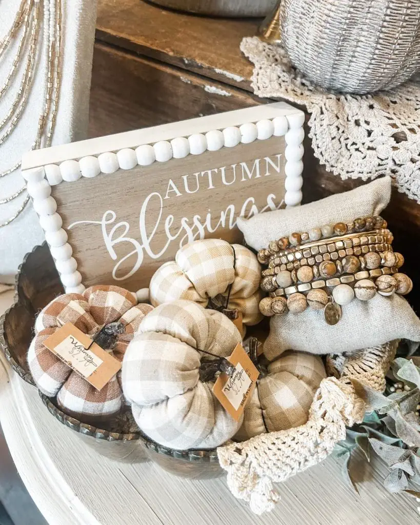 Fall decor with buffalo check pumpkins and Autumn Blessings sign