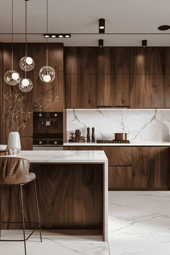 Luxurious kitchen with dark wood cabinets marble countertops and glass pendant lights