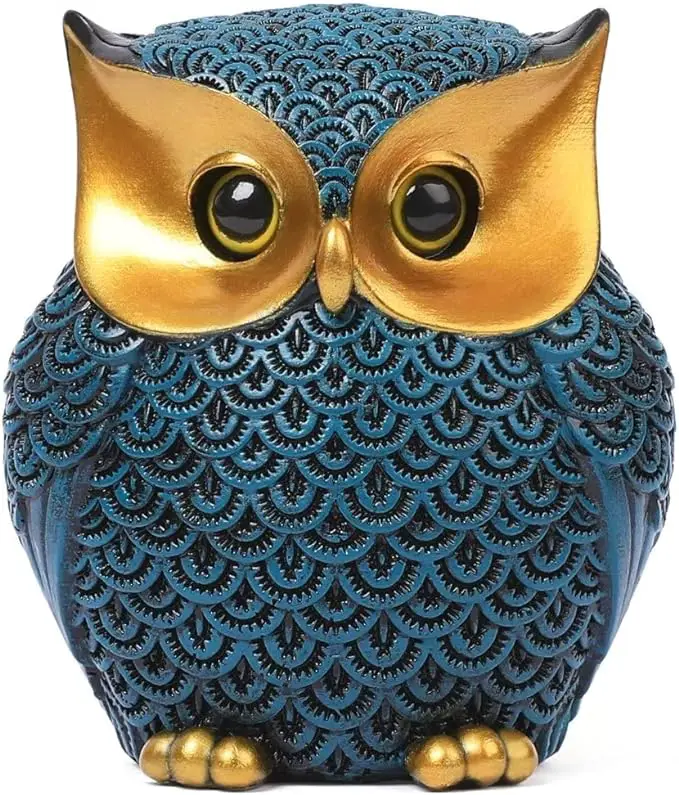 The owl has large, golden eyes and a golden beak that stand out prominently against its body