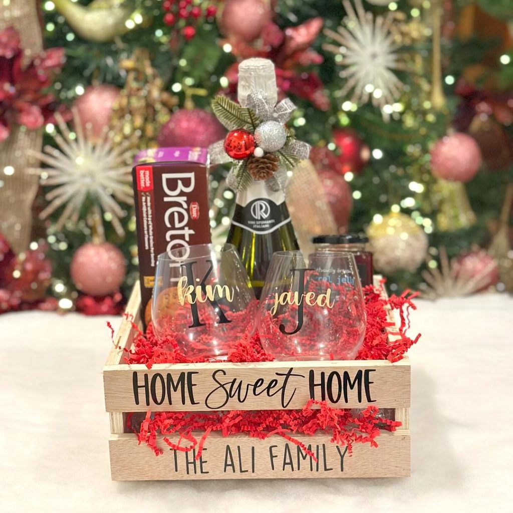 Personalized wooden crate with wine glasses and champagne