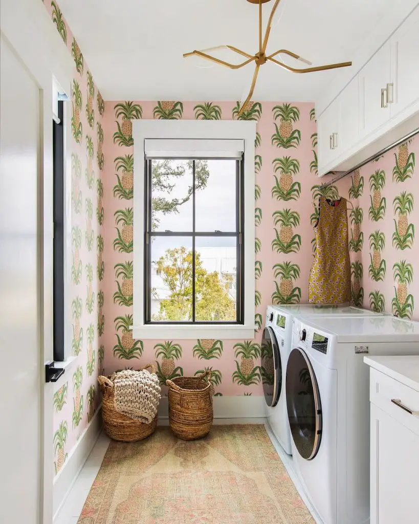 Laundry room with pink pineapple wallpaper
