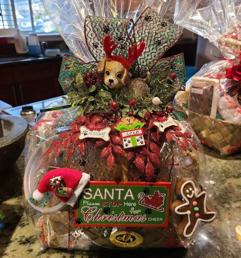 Christmas gift basket with dog treats and decorations