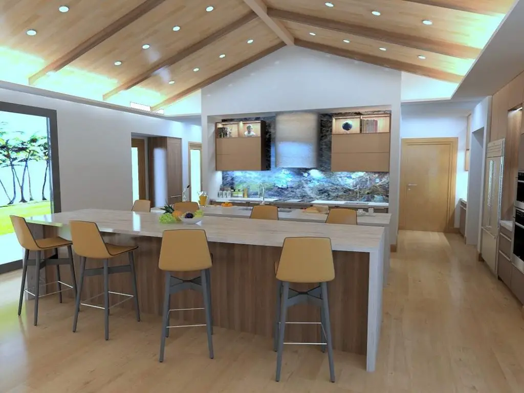 Bright kitchen with wooden ceiling beams and large island
