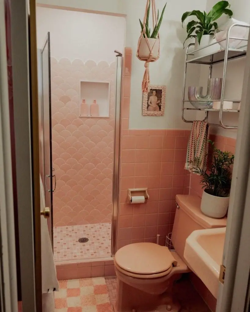 Pink retro bathroom with fish scale shower tiles