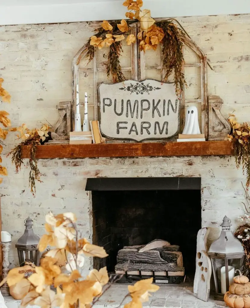Rustic fireplace mantel with Pumpkin Farm sign and fall decor.