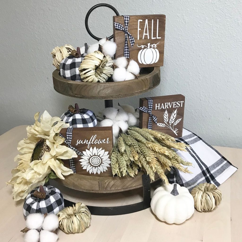 Tiered tray with buffalo check fall decor and wooden signs
