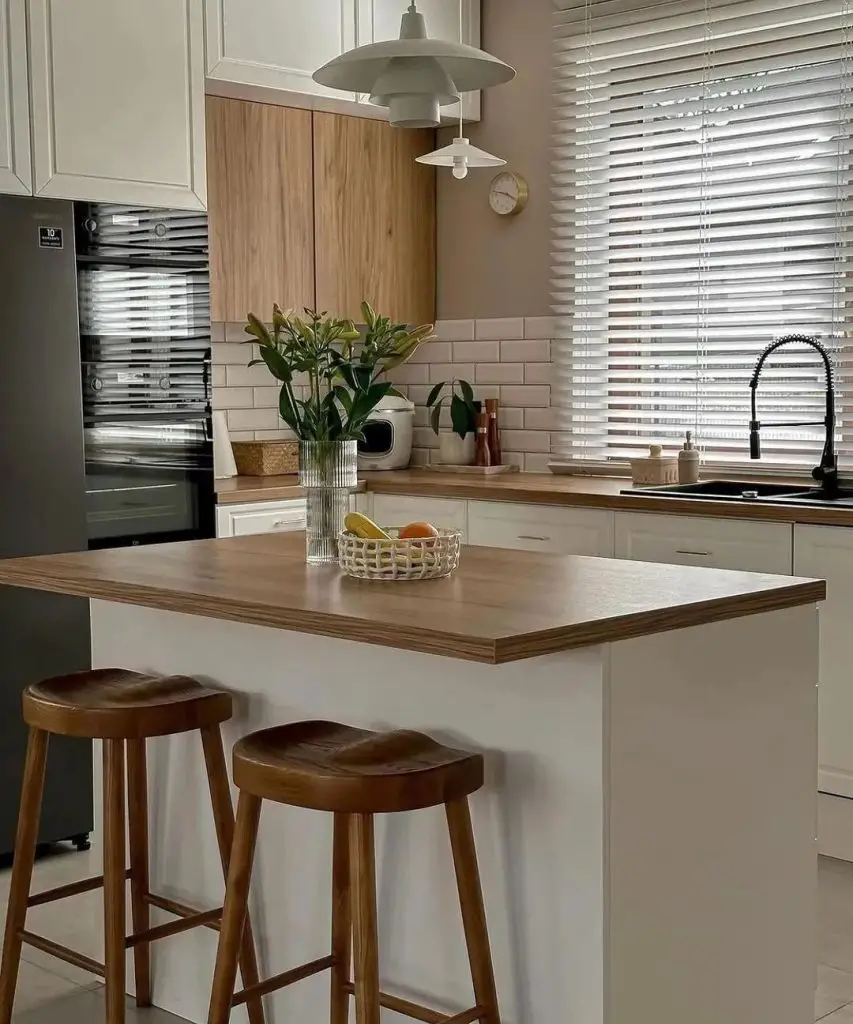 Bright kitchen with white cabinets and wooden accents