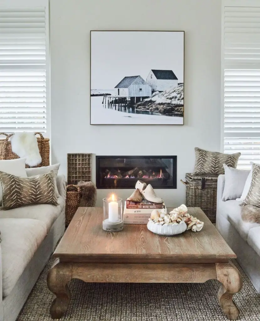 Coastal living room with rustic coffee table and fireplace