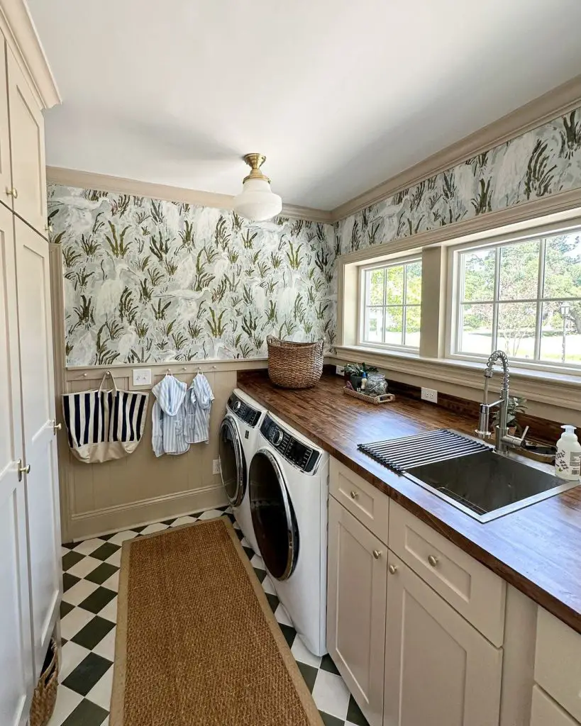 Cattail wallpapered laundry room, wooden countertop.