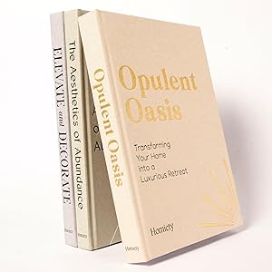 Three books are standing upright in a row. The visible titles are "Elevate and Decorate