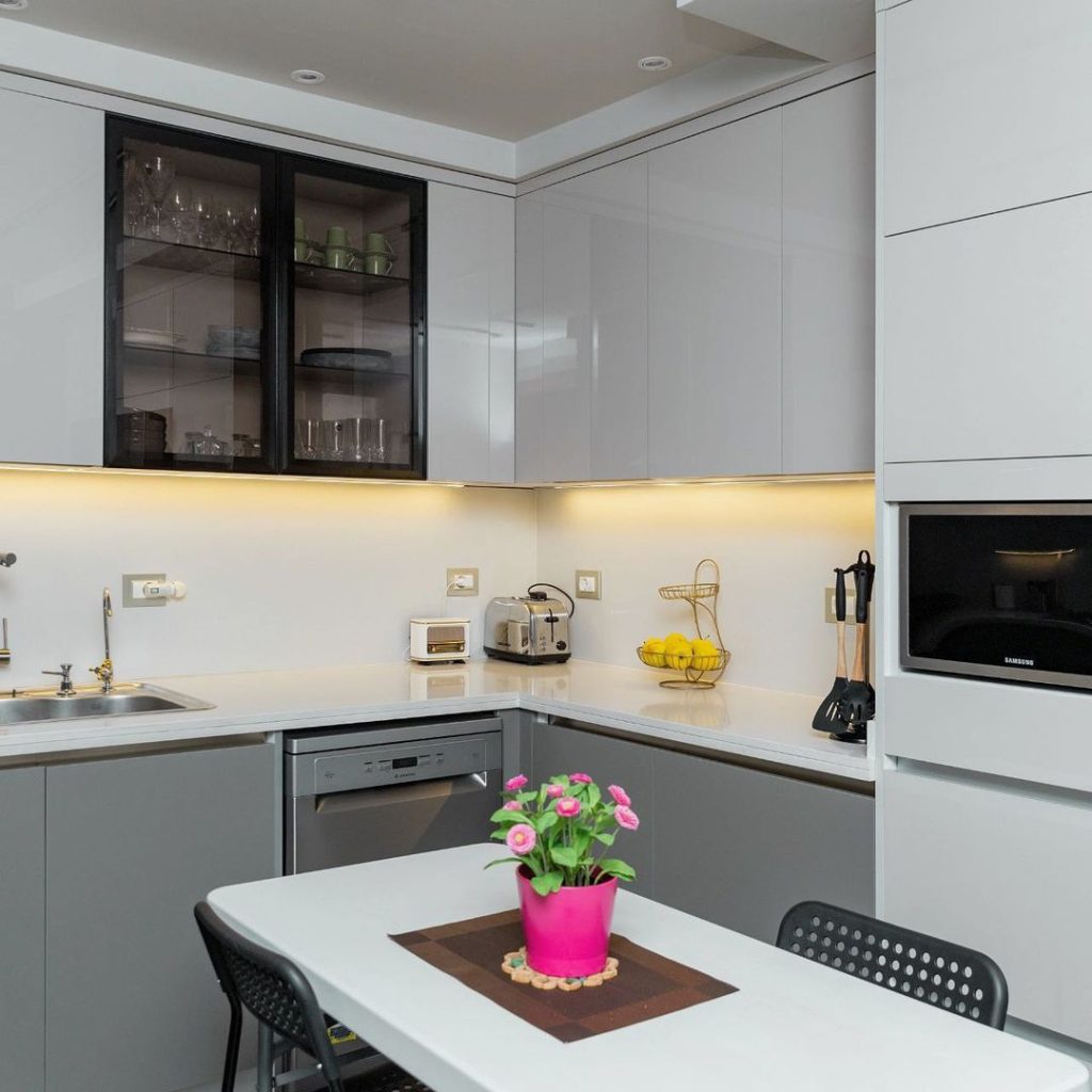 Modern white and gray kitchen with dining nook