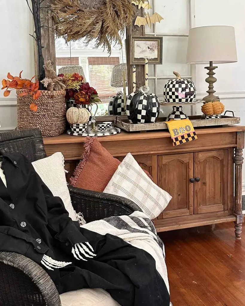 Fall decor with checkered pumpkins and skeleton throw