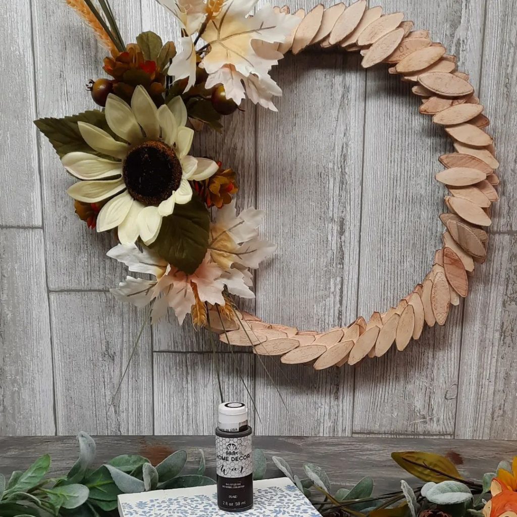 Wooden scale wreath with sunflower and fall leaves